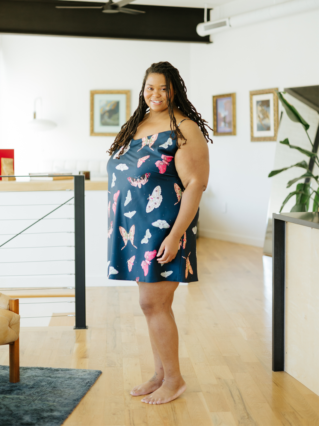 Moth print sleeveless above the knee slip dress with V-neck and thin adjustable straps.