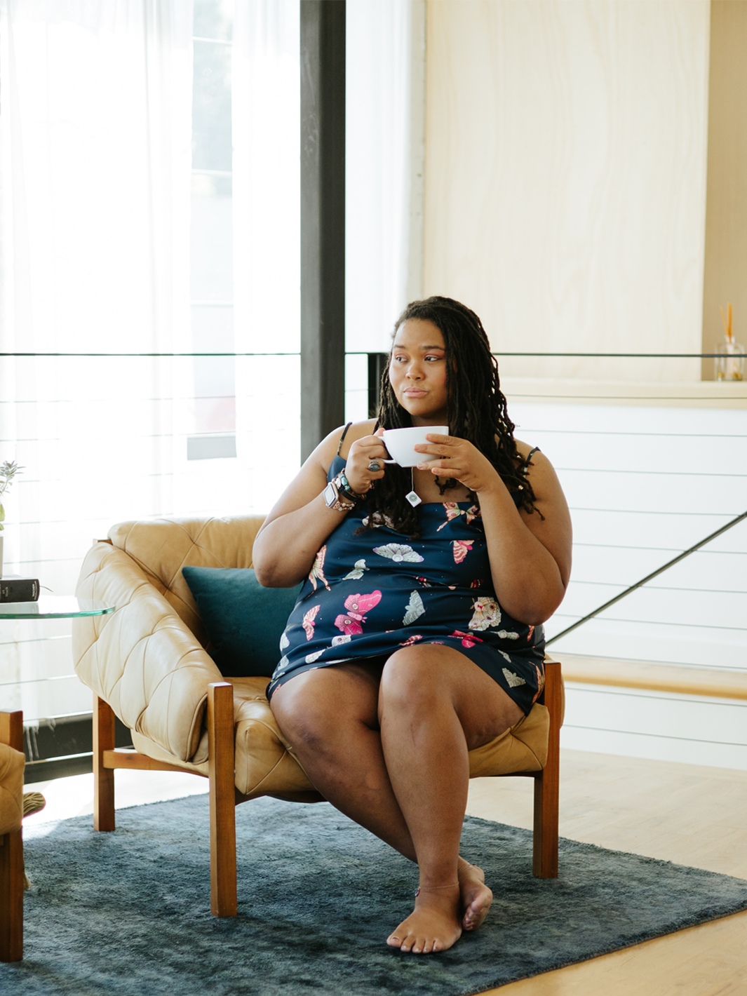 Moth print sleeveless above the knee slip dress with V-neck and thin adjustable straps.