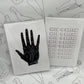 Art prints with white back ground. One with a black palmistry hand and the other saying Need a break repeating.