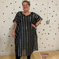 Black and silver striped kaftan showing the model in a size l/xl
