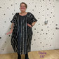 Black kaftan with silver stripes showing the model in size 1/2