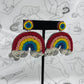 Beaded post earrings with beaded rainbows dangling down.