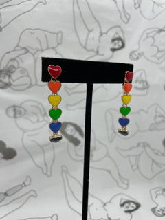 Post earrings with 6 hearts dangling in a line each one a color of the rainbow.