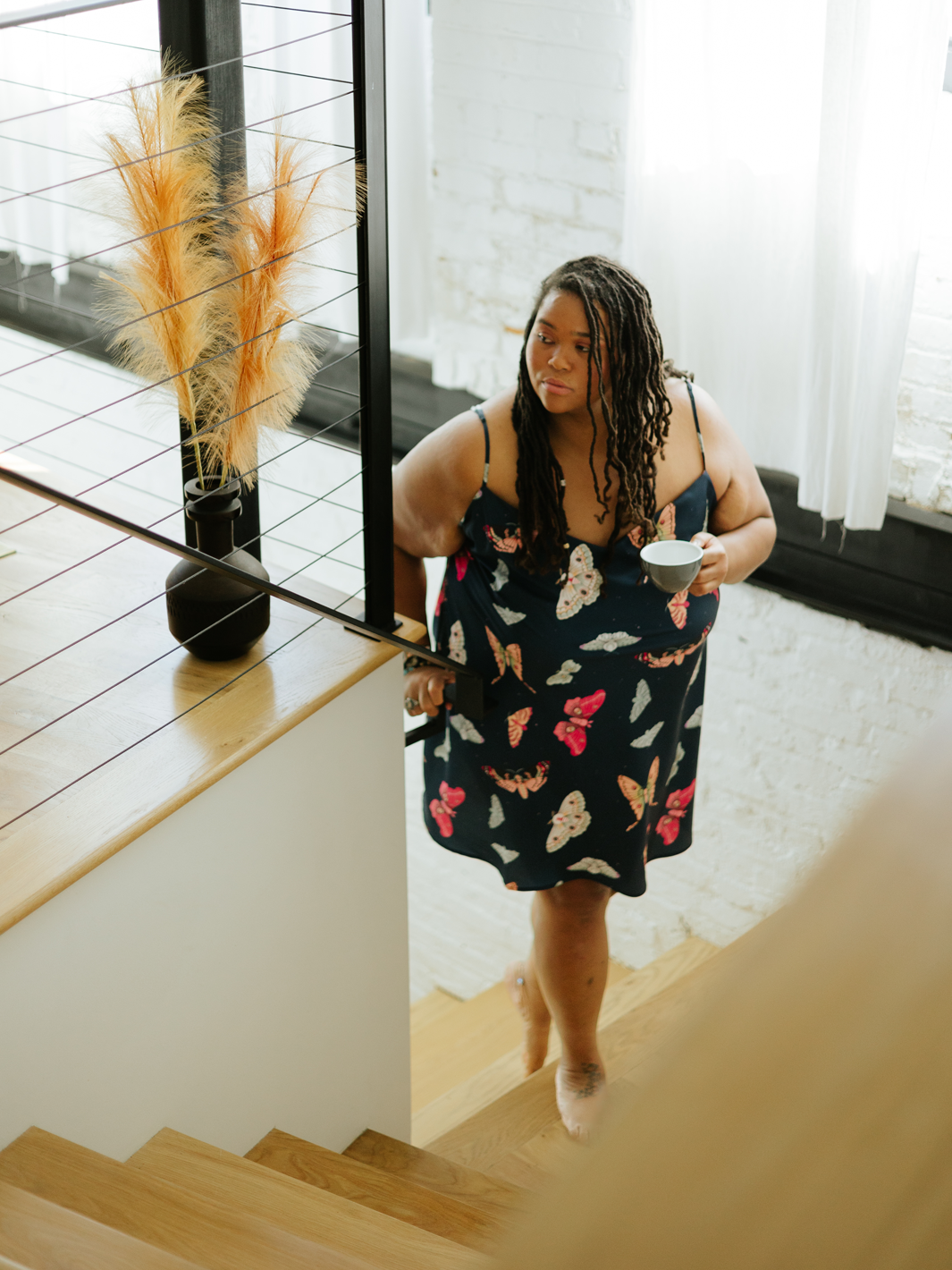 Moth print sleeveless above the knee slip dress with V-neck and thin adjustable straps.