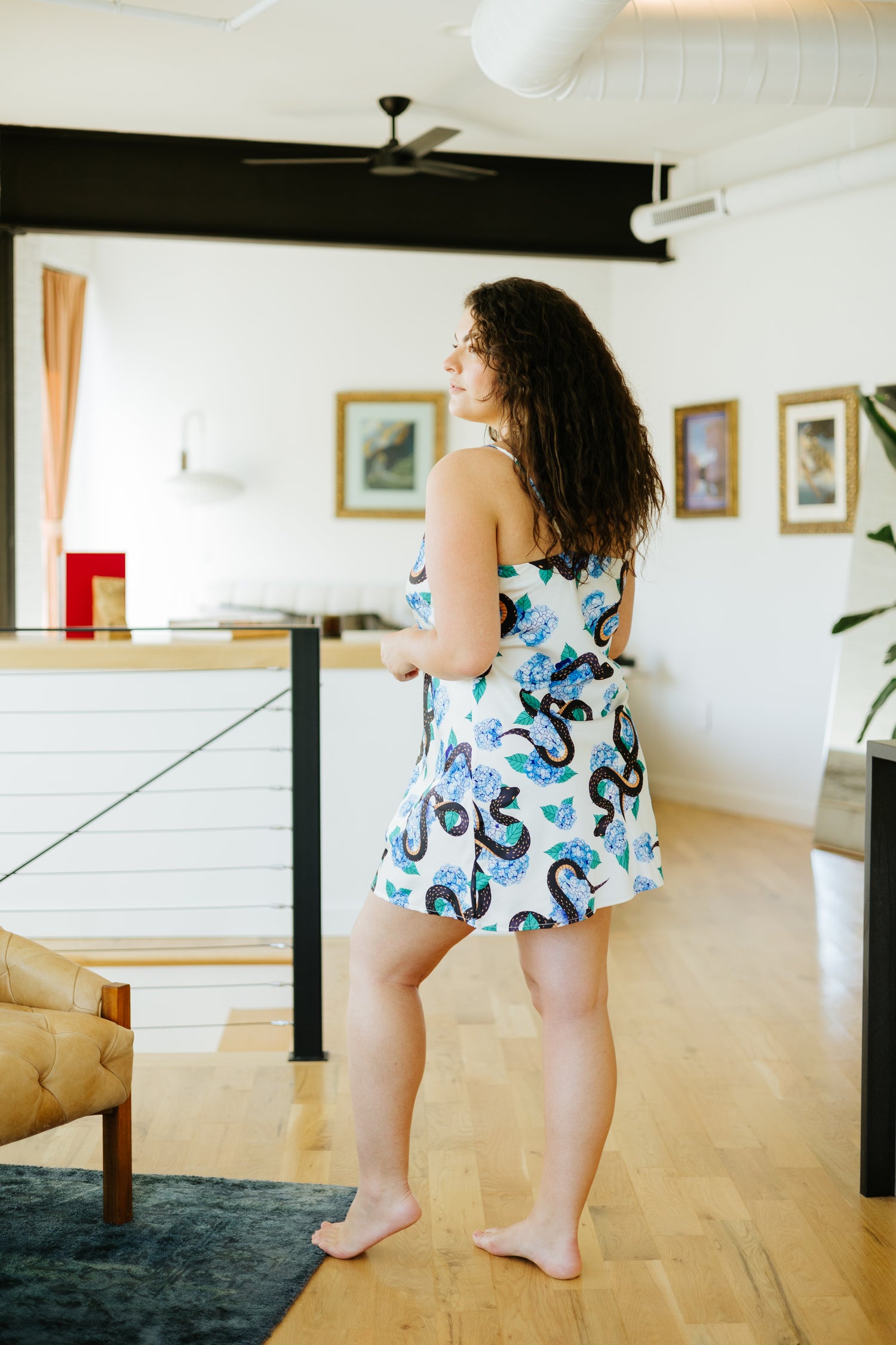 Black snake and blue floral print sleeveless above the knee slip dress with V-neck and thin adjustable straps.