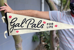 White pennant flag with kiss marks that says "Gal Pals for life" in black letters