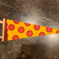 A pennant flag that looks like a slice of pepperoni pizza. 