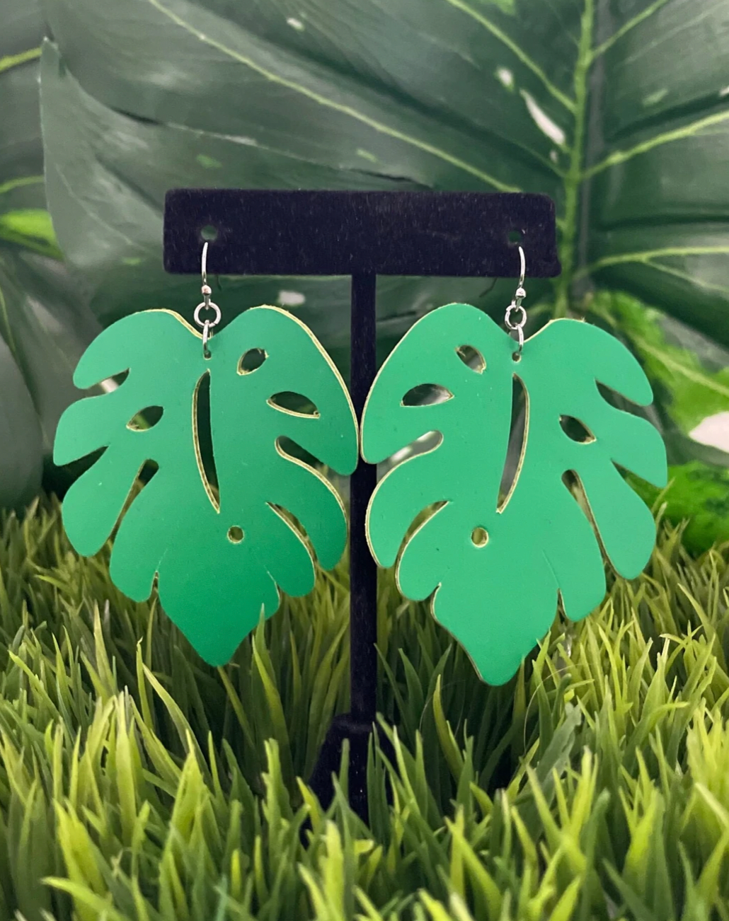 Big dangly simplistic green monstera earrings.