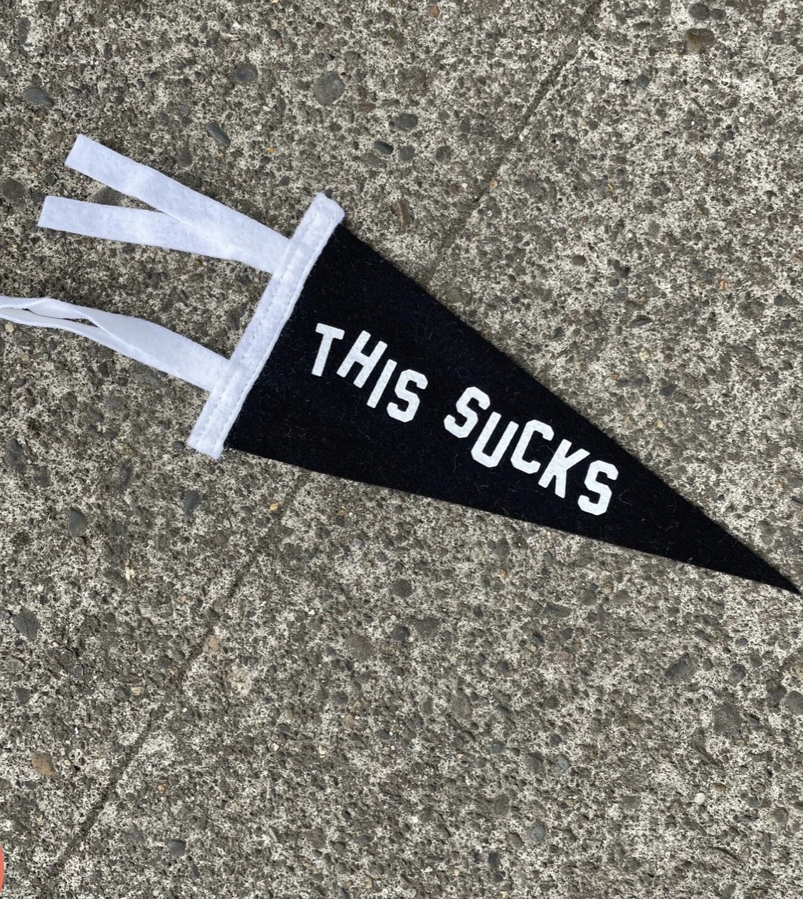 Black pennant flag that says 