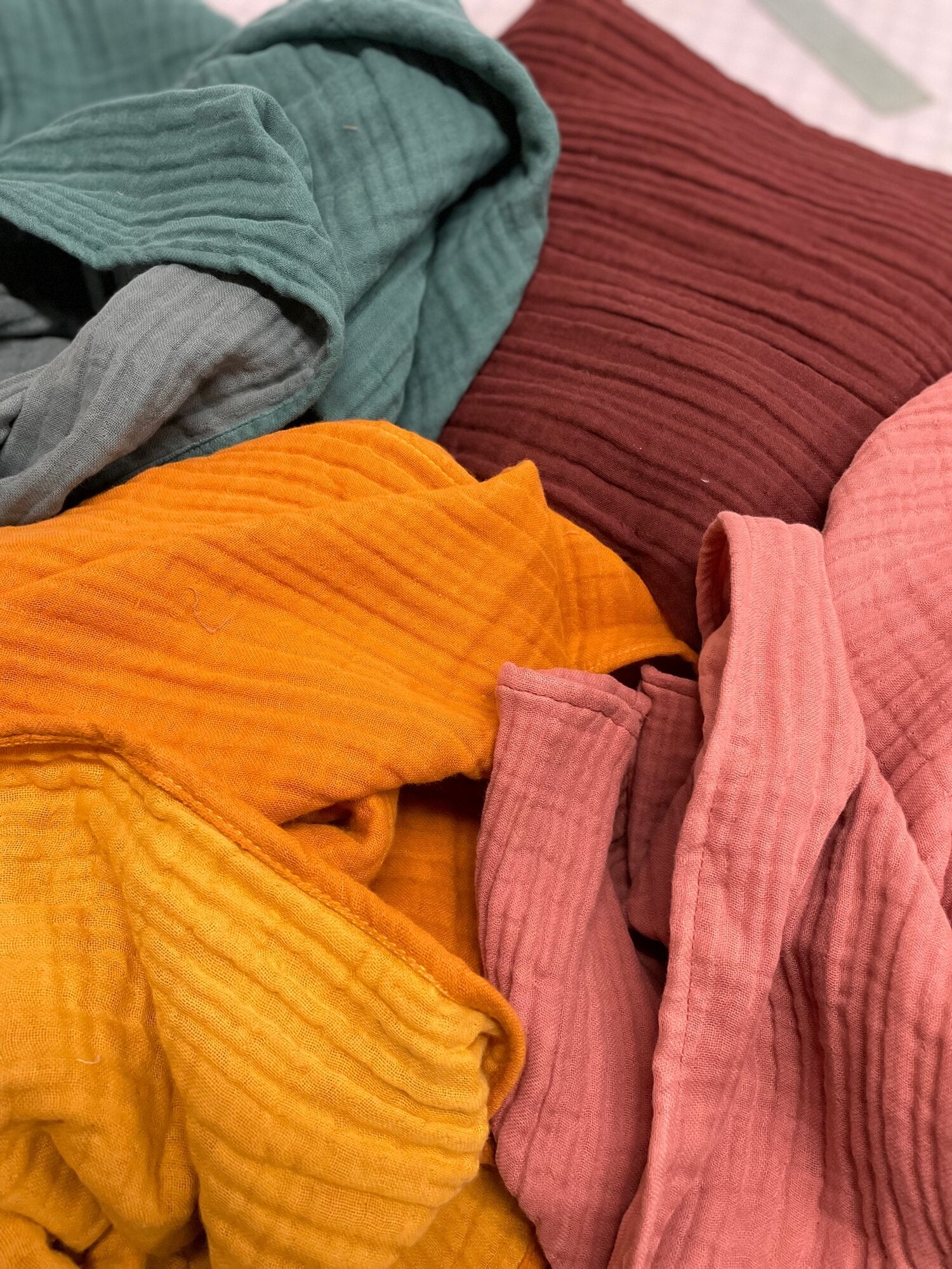 All colors of gauzy scarf shown together